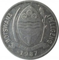 Botswana coin 1 Thebe (1976 - 1991) obverse obverse of 1 Thebe (1976 - 1991) coin with KM# 3 from Botswana. Inscription: BOTSWANA IPELEGENG PULA 1976