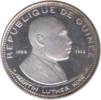 obverse of 100 Francs Guinéens - Martin Luther King (1969 - 1970) coin with KM# 9 from Guinea. Inscription: REPUBLIQUE DE GUINEE 1929 1968 MARTIN LUTHER KING