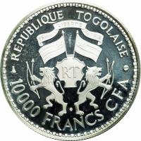Togo coin 10000 Francs - General Gnassingbe Eyadema (1977) reverse reverse of 10000 Francs - General Gnassingbe Eyadema (1977) coin with KM# 9 from Togo. Inscription: REPUBLIQUE TOGOLAISE TRAVAIL LIBERTE PATRIE RT 10000 FRANCS CFA