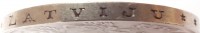 edge of 5 Lati (1929 - 1932) coin with KM# 9 from Latvia. Inscription: DIEVS *** SVETI *** LATVOJU ***