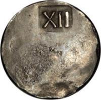 United States coin 1 Shilling (1652) reverse reverse of 1 Shilling (1652) coin from United States. Inscription: XII