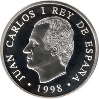 obverse of 1000 Pesetas - Juan Carlos I - Lisbon Expo, 1998 (1998) coin with KM# 1000 from Spain. Inscription: JUAN CARLOS I REY DE ESPAÑA · 1998 ·