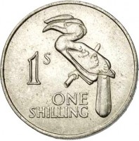 reverse of 1 Shilling (1964) coin with KM# 2 from Zambia. Inscription: 1S ONE SHILLING