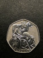 reverse of 50 Pence - Elizabeth II - 2012 London Paralympics: Wheelchair Rugby - 4'th Portrait (2011) coin with KM# 1187 from United Kingdom. Inscription: 50 PENCE