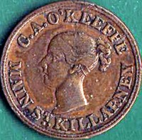 obverse of 1 Farthing - Victoria coin from Ireland. Inscription: C.A. O'KEEFFE MAIN ST., KILLARNEY