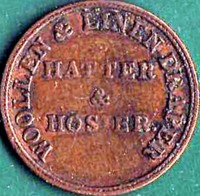 reverse of 1 Farthing - Victoria coin from Ireland. Inscription: WOOLEN & LINEN DRAPER HATTER & HOSIER