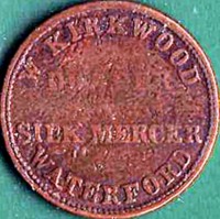 Ireland coin 1 Farthing reverse reverse of 1 Farthing coin from Ireland. Inscription: W. KIRKWOOD DRAPER & SILK MERCER WATERFORD