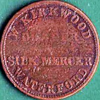 reverse of 1 Farthing coin from Ireland. Inscription: W. KIRKWOOD DRAPER & SILK MERCER WATERFORD