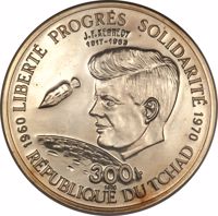 reverse of 300 Francs - 10th Anniversary of Independence (1970) coin with KM# 7 from Chad. Inscription: LIBERTE PROGRES SOLIDARITE J.F. KENNEDY 1917 - 1963 300 fr 1970 REPUBLIQUE DU TCHAD