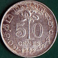 Ceylon coin 50 Cents - George VI (1942) reverse reverse of 50 Cents - George VI (1942) coin with KM# 114 from Ceylon. Inscription: CEYLON 50 CENTS ௫௦.௧தம ශන ඵණහ · 1942 ·
