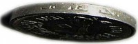 edge of 10 Millièmes (1967) coin with KM# 411 from Egypt. Inscription: ﺟ ﻋ ﻣ * ﺟ ﻋ ﻣ * ﺟ ﻋ ﻣ *