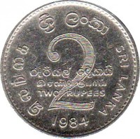 reverse of 2 Rupees (1984 - 2004) coin with KM# 147 from Sri Lanka. Inscription: இலங்கை ශ්‍රී ලංකා SRI LANKA 2 රුපියල දෙකයි இரண்டு ரூபாய் TWO RUPEES 1984