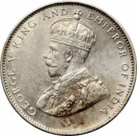 Ceylon coin 50 Cents - George V (1919 - 1929) obverse obverse of 50 Cents - George V (1919 - 1929) coin with KM# 109a from Ceylon. Inscription: · GEORGE V KING AND EMPEROR OF INDIA