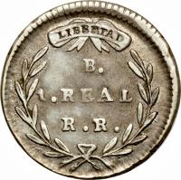 reverse of 1 Real (1827 - 1836) coin with KM# 87 from Colombia. Inscription: LIBERTAD B. 1. REAL. R.S.
